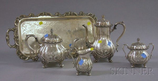 Five-Piece Wilcox International Silver Plated Tea: Five-Piece Wilcox International Silver Plated Tea and Coffee Set, Du Barry pattern, includes tea and coffee pots, creamer, sugar bowl, and tray, (dent, hinge broken).