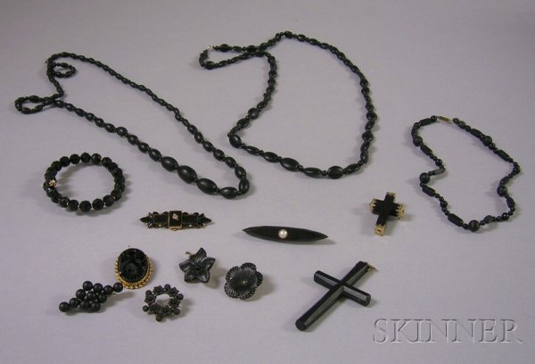 Group of Assorted Jet and Mourning Jewelry, includ: Group of Assorted Jet and Mourning Jewelry, including several beaded necklaces, bracelets, and brooches, and two cross pendants, one gold-mounted.