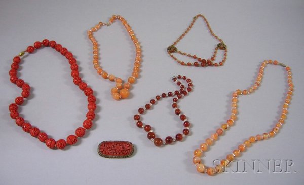 Group of Carnelian and Cinnabar Jewelry, including: Group of Carnelian and Cinnabar Jewelry, including five beaded necklaces and one Chinese carved cinnabar brooch.