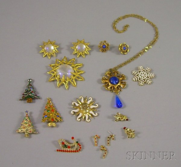 Group of Mostly Signed Costume Jewelry, including : Group of Mostly Signed Costume Jewelry, including Christmas tree brooches by Gerry's, ART, and Bauer, two enameled Movitz brooches, two J.J. suites, and additional Christmas-themed items.