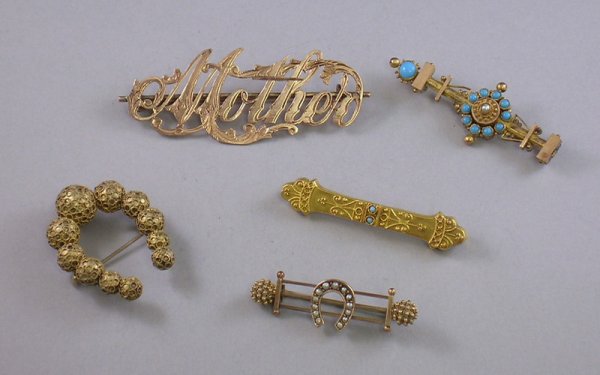 Five Gold and Gold-tone Victorian Brooches, one 18