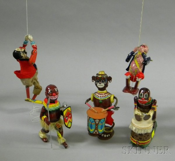 Five Lithographed Tin Clockwork Toys, two Line-Ma: Five Lithographed Tin Clockwork Toys, two Line-Mar native drummers, a native with spear and shield, clambering pirate, and clambering clown.