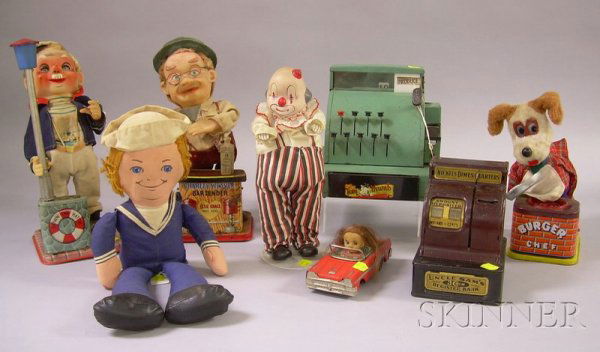 Eight Mid-20th Century Toys, a "Down the Hatch" b: Eight Mid-20th Century Toys, a "Down the Hatch" battery-powered toy, an "Uncle Sam Register Bank, a wind-up clown, a "Burger Chef" cooking dog toy, a green "Tom Thumb Cash Register", a friction-powere