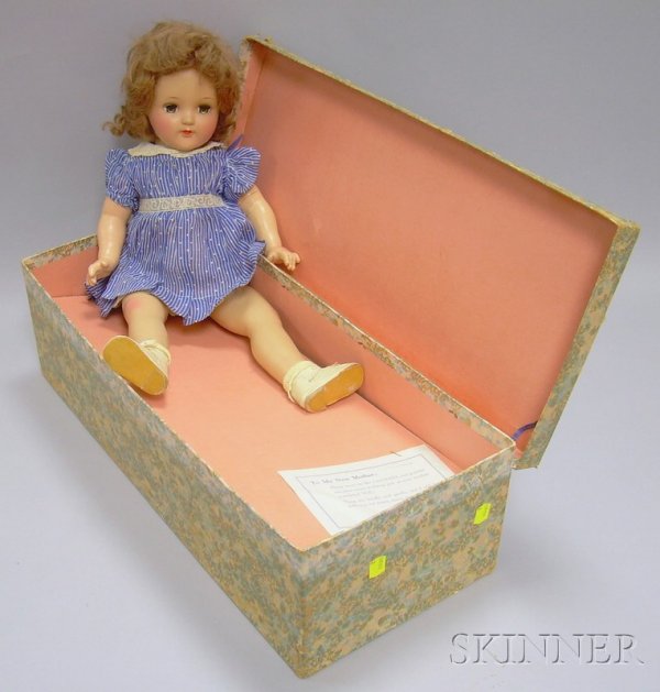 Ideal Boxed Baby Doll, closed mouth, blue eyes, bl: Ideal Boxed Baby Doll, closed mouth, blue eyes, blue and white dress, in original box, with "Magic Skin Baby" paper tag, ht. 20 1/2 in.