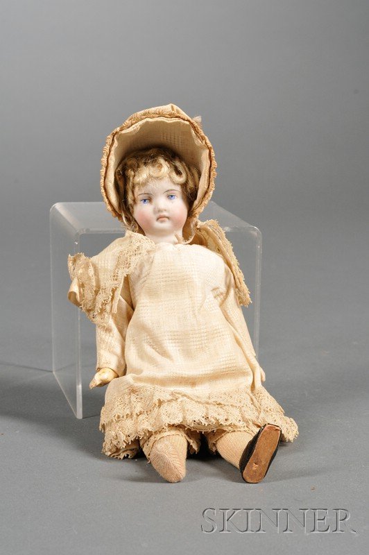 Small Bisque Head Doll, late 19th century, solid p: Small Bisque Head Doll, late 19th century, solid pate and flange neck, molded features, blue-painted eyes and closed mouth, blonde mohair curls fashioned into a wig, five-piece composition body, joint