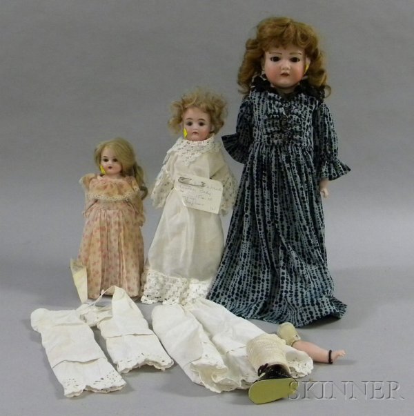 Three Bisque Shoulder Head Dolls, one marked "Flor