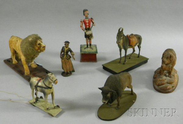 Group of Painted Composition and Carved Wooden Fig: Group of Painted Composition and Carved Wooden Figural Animal Pull-toys, a Wind-up Drummer, a Painted Figure of a Woman, and a Black Forest St. Bernard, pull-toys include a horse, buffalo, donkey, and