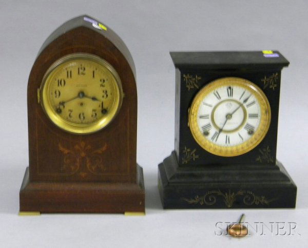 Two Connecticut Mantel Clocks, the first, by Seth: Two Connecticut Mantel Clocks, the first, by Seth Thomas, a mahogany lancet case with floral and line inlay, Arabic numeral dial and eight-day time and strike movement, the last, an Ansonia black iron