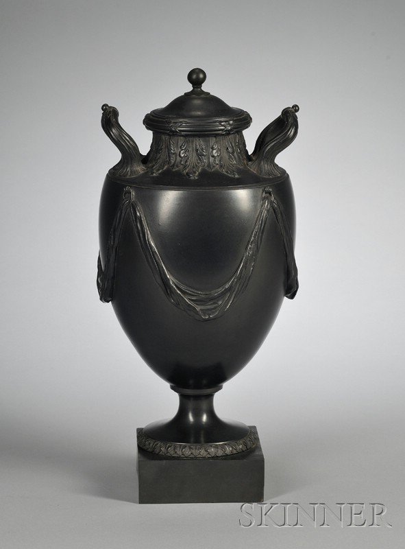 Wedgwood and Bentley Black Basalt Vase and Cover, : Wedgwood and Bentley Black Basalt Vase and Cover, England, c. 1775, upturned handles to shoulders decorated with applied leaves, the sides with drapery festoons, raised lozenge mark, ht. 15 1/2 in.