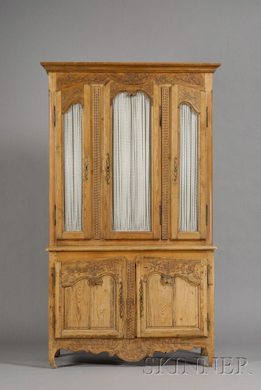 Louis XV Style Carved Pine Two-Part Cabinet, 19th : Louis XV Style Carved Pine Two-Part Cabinet, 19th century, molded cornice above three grill-inset doors with shaped panels and foliate carving; projecting lower section with two doors enclosing an int