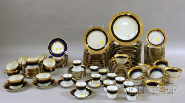 Assembled 136-piece Gilt and Cobalt Banded Porcela: Assembled 136-piece Gilt and Cobalt Banded Porcelain Partial Dinner Set, including fifty-seven pieces of Limoges, a set of eleven Minton bread plates, eleven Limoges bouillon cups and saucers, twelve 