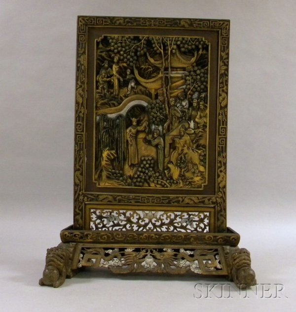Asian Carved and Gilded Screen, carved with a cent: Asian Carved and Gilded Screen, carved with a central scene of officials and their family members entertaining among pavilion and garden, with borders decorated with cranes in flight and auspicious sy