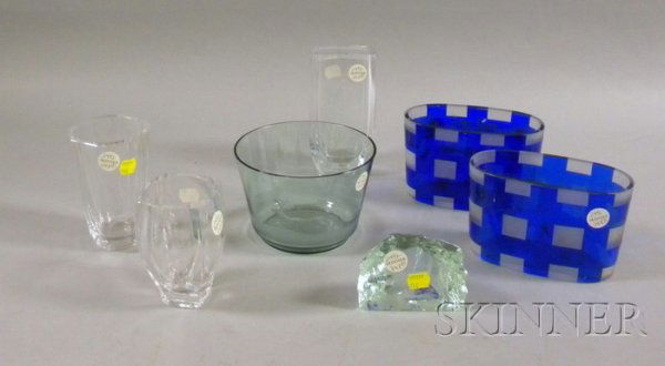 Seven Pieces of Continental Art Glass, including: Seven Pieces of Continental Art Glass, including a green etched Kosta bookend, three colorless Skruf vases, a green etched bowl, and two blue and white oval containers.