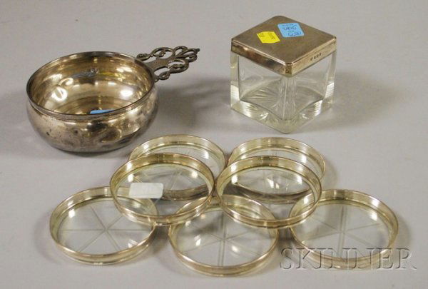 Three Sterling Serving and Decorative Items, a Cart: Three Sterling Serving and Decorative Items, a Cartier porringer, a Birmingham, England, sterling and colorless glass box, and a set of five nested Frank Whiting coasters with sterling rims.