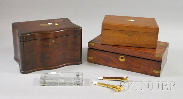 Five Cigar Smoking Related Items and a Brass-mount: Five Cigar Smoking Related Items and a Brass-mounted Rosewood Veneer Lap Desk, two mahogany humidors with milk glass linings, two cigar cutters including one Dunhill, and a colorless molded glass ciga