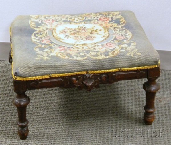 Victorian Renaissance Revival Needlepoint Upholste: Victorian Renaissance Revival Needlepoint Upholstered Carved Walnut Footstool, lg. 20 in.