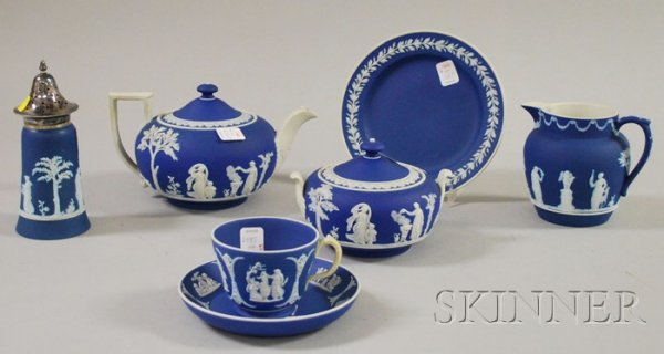 Seven Wedgwood Dark Blue Jasper Dip Items, two tea: Seven Wedgwood Dark Blue Jasper Dip Items, one teapot, a sugar caster, jug, tea tile, covered sugar, cup and saucer, all impressed "Wedgwood," tile/trivet impressed "Wedgwood, England," (good conditio