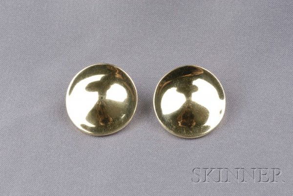 18kt Gold Earclips, Robert Lee Morris, each design: 18kt Gold Earclips, Robert Lee Morris, each designed as a circular form with raised center, 8.1 dwt, lg. 3/4 in.