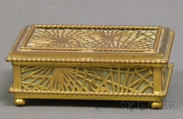 Tiffany Studio Desk Box Mottled glass and bronze N: Tiffany Studio Desk Box Mottled glass and bronze New York, early 20th century Pine needle pattern overlay with green and gold mottled glass, marked Tiffany Studios, New York 800, ht. 1 1/2, lg. 4 1/2,