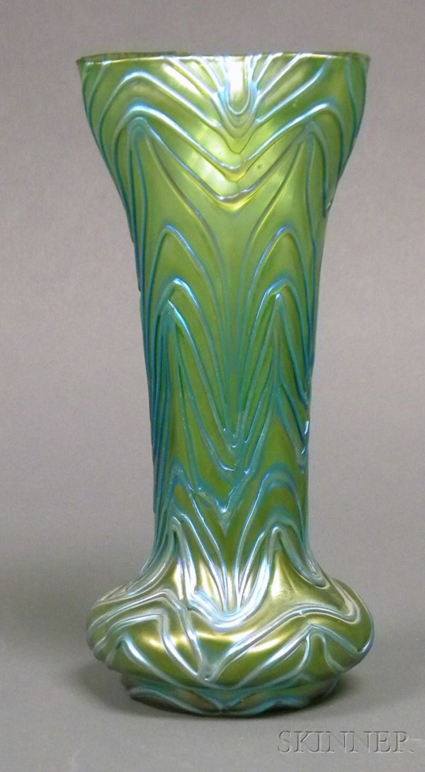 Art Glass Vase, Possibly Loetz Threaded and irides: Art Glass Vase, Possibly Loetz Threaded and iridescent glass Bohemia, early 20th century Tri-corner rim on cylindrical body flowing to bulbous base in green iridescent glass with blue iridescent threa