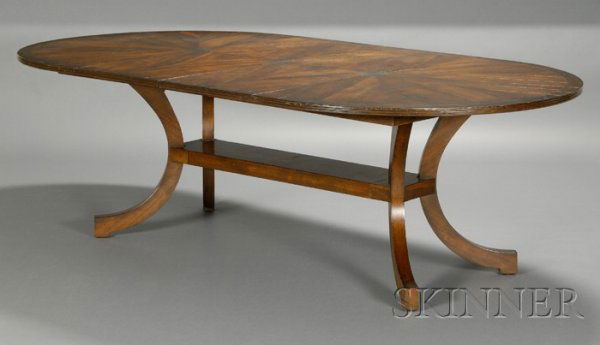 Holly Hunt New Classics Custom Dining Table Walnut: Holly Hunt New Classics Custom Dining Table Walnut and brass Patterned walnut oval top with three metal medallions and border ring, raised on four curved legs with connecting horizontal support, ht. 2