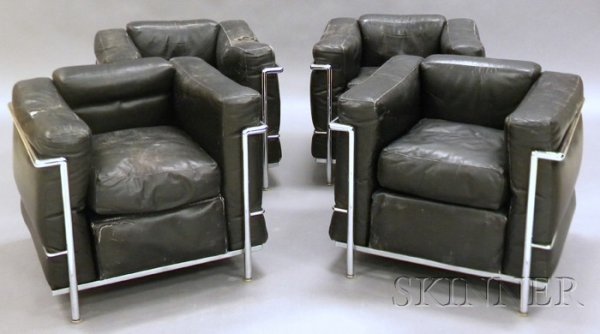 , Four Le Corbusier LC2 Chairs, Leather and steel,: Four Le Corbusier LC2 Chairs Leather and steel Manufactured by Cassina Tubular steel frame with black leather cushions arm, back and seat cushions, some wear and damage to leather, Corbusier signature