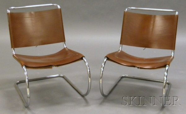 Two Knoll Lounge Chairs Leather and steel Knoll As: Two Knoll Lounge Chairs Leather and steel Knoll Associates Inc., 329 Park Avenue, New York Tubular steel frame with leather seat and back covers with laced closure, Knoll Associates paper label, ht. 2