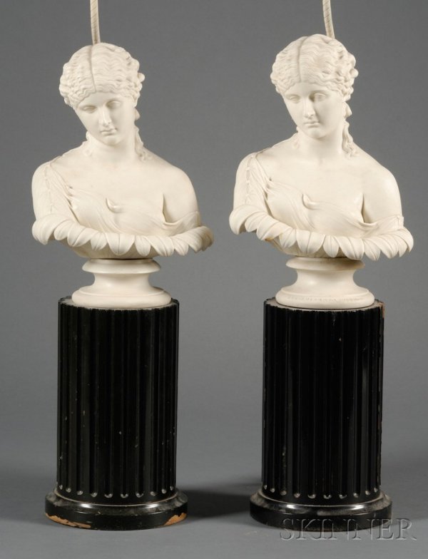 Two Parian Busts/Lamp Bases, England, mid-19th cent: Two Parian Busts/Lamp Bases, England, mid-19th century, each modeled as Daphne and mounted atop a waisted circular socle, ht. 13; set atop ebonized columnar bases and electrified, overall ht. 24 in.