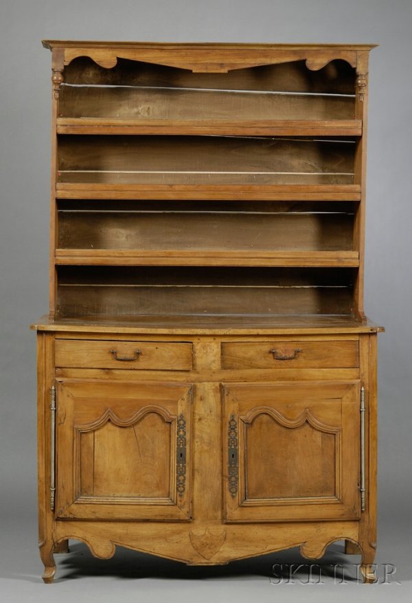 French Provincial Cherry Buffet a Deux Corps, uppe: French Provincial Cherry Buffet a Deux Corps, upper section with molded cornice above open shelves, lower section with two drawers and two doors, on scrolled feet, ht. 84, wd. 53 1/2, dp. 25 in.