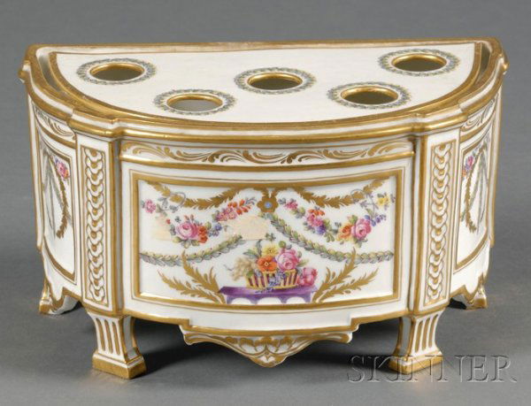 Continental Porcelain Bough Pot and Cover, late 19: Continental Porcelain Bough Pot and Cover, late 19th century, D-shaped with paneled sides, gilt and enamel decorated with floral and foliate swags and a basket of flowers, lg. 10 in.