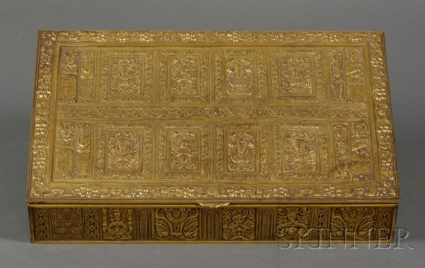 Gilt-bronze Humidor, attributed to J.E. Caldwell, : Gilt-bronze Humidor, attributed to J.E. Caldwell, Philadelphia, rectangular shape with hinged lid, paneled design with mask heads and figures bordered with foliage and fruit, lg. 11 7/8 in.