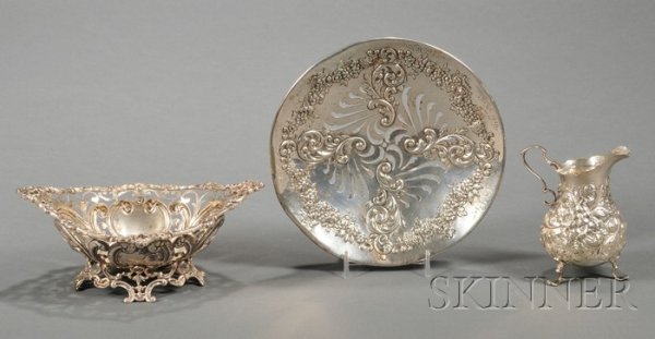 Three Small Sterling Tablewares, late 19th century: Three Small Sterling Tablewares, late 19th century, two by Howard & Co., including an 1888 floral repousse pear-shaped creamer, ht. 4 1/4, and a pierced plate with low foot, 1893, with small presentat
