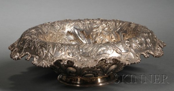 S. Kirk & Son Co. Sterling Repousse Fruit Bowl, 19: S. Kirk & Son Co. Sterling Repousse Fruit Bowl, 1903-24, the sides and wide, downswept rim chased and embossed with dense foliates on stippled ground, with scalloped rim applied with rocaille scrolls,
