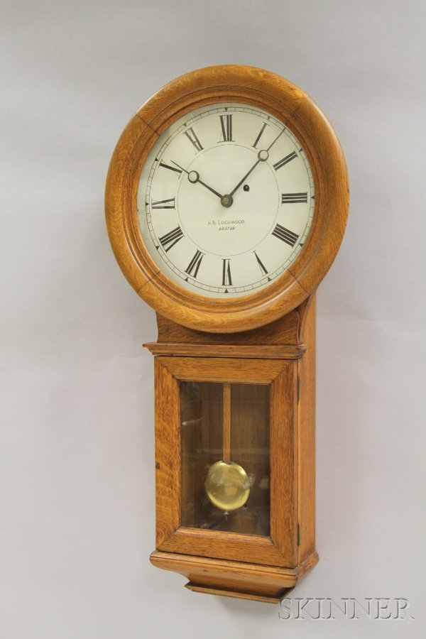 Oak Wall Regulator by Chelsea, Boston, #70 case fo: Oak Wall Regulator by Chelsea, Boston, #70 case form, 13 1/2 in. dia. zinc dial with Roman numerals and marked H.N. Lockwood, Boston, eight-day time-only movement marked Chelsea Clock Company, with pe