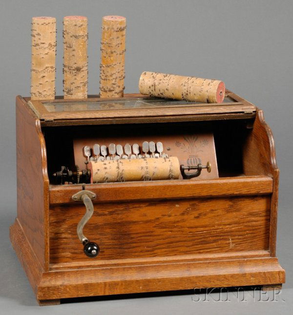 Oak Cased Roller Organ by Autophone Company, Ithac: Oak Cased Roller Organ by Autophone Company, Ithaca, New York, twenty-note organette marked on top Chautauqua Roller Organ, glazed and hinged lid to access the 6 1/2 in. wooden cobs, front wooden hand