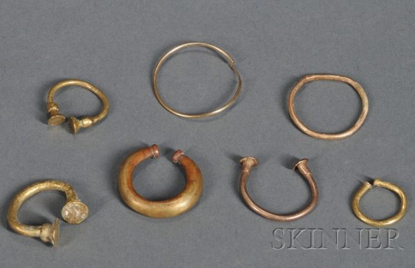Seven Pre-Columbian Metal Nose Ornaments, Colombia,: Seven Pre-Columbian Metal Nose Ornaments, Colombia, various styles, some gold, some Tumbaga, dia. to 1 1/8 in.