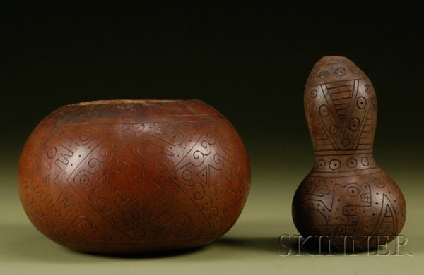 Two Pre-Columbian Decorated Gourds, Peru, Nazca, c: Two Pre-Columbian Decorated Gourds, Peru, Nazca, c. 200-600 A.D., both with incised decoration, the first with chevrons filled with abstract curvilinear and avian designs, the second decorated with a 