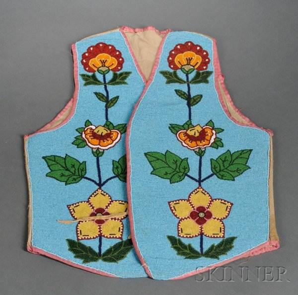 Plateau Man's Vest Beaded Hide Vest, c. first quar: Plateau Man's Vest Beaded Hide Vest, c. first quarter 20th century, cloth lined and beaded on the front with multicolored floral design on a medium blue background, lg. 20 1/2 in. Provenance: Lammers 