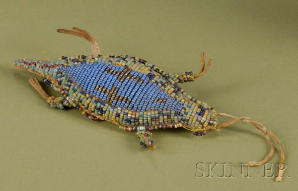 Plains Beaded Hide Umbilical Fetish, c. late 19th : Plains Beaded Hide Umbilical Fetish, c. late 19th century, in the form of a lizard, with multicolored glass and metallic geometric designs, lg. 5 1/2 in.