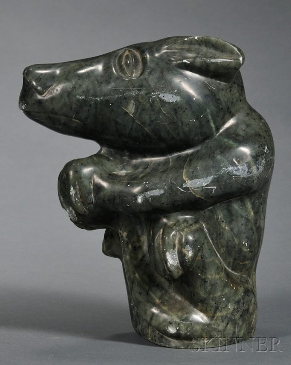 Inuit Soapstone Carving, c. 20th century, in the f: Inuit Soapstone Carving, c. 20th century, in the form of a seated animal holding its tail, incised signature at bottom, (minor damage), ht. 8 in.