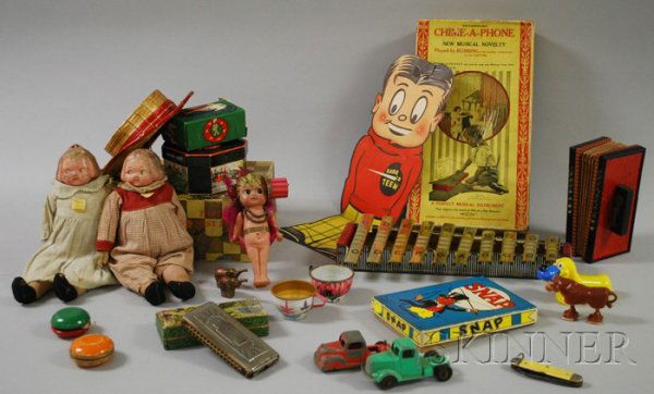 Group of Assorted Toys and Games, including a Haro: Group of Assorted Toys and Games, including a Harold Teen cardboard figure/ventriloquism dummy, two composite dolls, several toy instruments, an Echo Harp in original box, a Chime-A-Phone musical inst