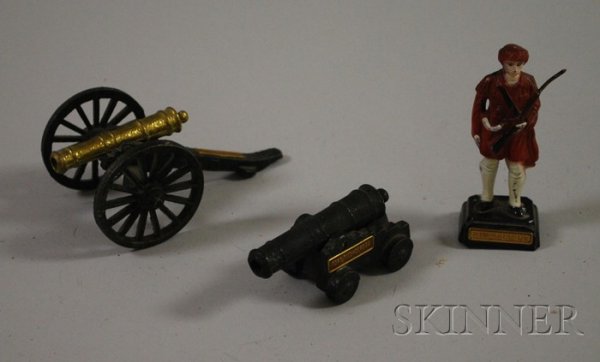 Three Fort Ticonderoga Lead and Metal Toys, a stan: Three Fort Ticonderoga Lead and Metal Toys, a standing soldier with gun, and two toy canons.