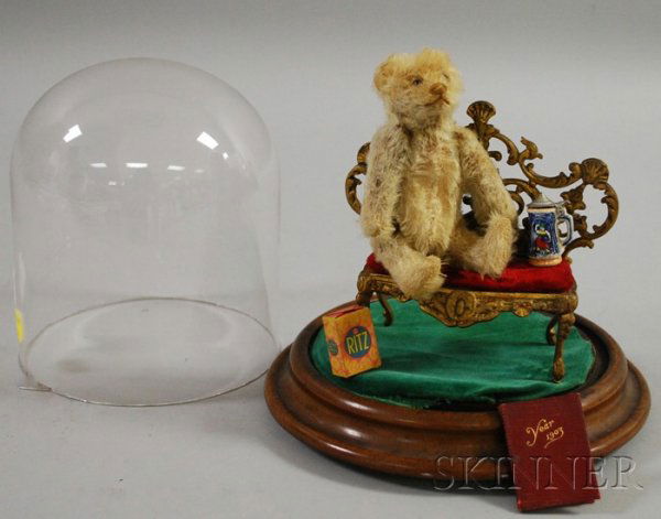 Steiff Teddy Bear and Glass Dome, Germany, c. 1920: Steiff Teddy Bear and Glass Dome, Germany, c. 1920, ht. 5 1/2, white mohair with brown glass eyes, tan stitched nose, mouth, and claws, felt pads, excelsior stuffed and original underscored "f" button