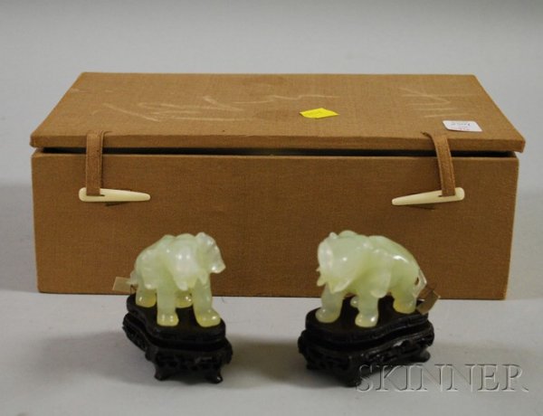 Pair of Carved Bowenite Elephants, cased, with acc: Pair of Carved Bowenite Elephants, cased, with accompanying wooden stands, ht. 2 1/4 in.