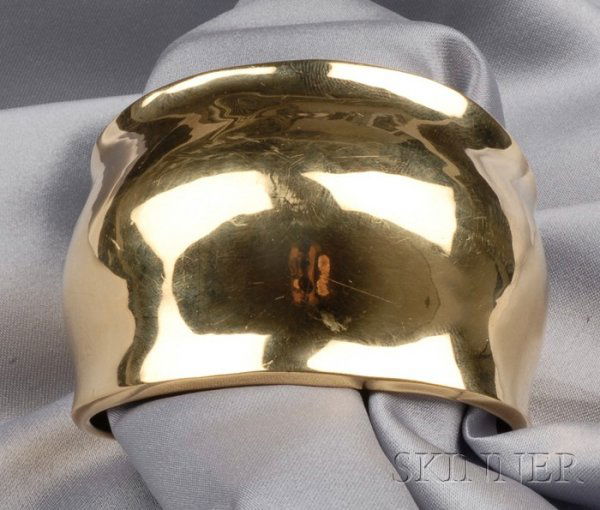 18kt Gold "Gamma" Cuff, Robert Lee Morris, c. 1975,: 18kt Gold "Gamma" Cuff, Robert Lee Morris, c. 1975, 61.5 dwt, interior circ. 6 in., with incised signature. Note: The following collection of Robert Lee Morris jewelry represents shapes and forms from