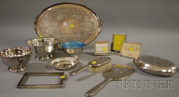 Seven Sterling Desk and Dresser Sterling Items, in: Seven Sterling Desk and Dresser Sterling Items, including a hand mirror, brush, and three table picture frames, also sold with a quantity of silver plated tabletop and decorative items, oval tray, thr
