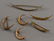 425: Six Antique Gold and Seed Pearl Crescent Brooches,
