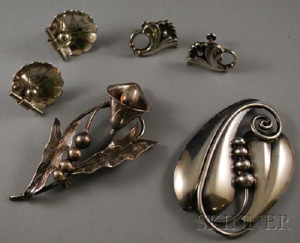 Four Georg Jensen Sterling Silver Jewelry Items, a: Four Georg Jensen Sterling Silver Jewelry Items, a Georg Jensen USA brooch and scallop shell earrings, and a Georg Jensen LaPaglia floral brooch and earrings.