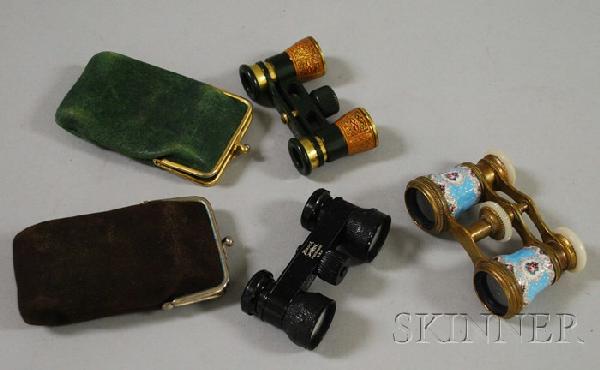 Three Pairs of Opera Glasses, an antique enameled: Three Pairs of Opera Glasses, an antique enameled pair, Lamare, Paris, (enamel loss), and two German pairs, Busch, one of gilt-tooled leather, both cased.