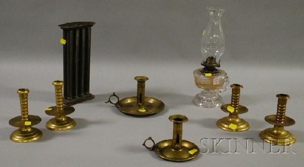 Eight Miscellaneous Lighting Related Items, a glas: Eight Miscellaneous Lighting Related Items, a glass kerosene lamp, two brass chambersticks, two pairs of brass capstan-type candlesticks, and a tin candle mold.